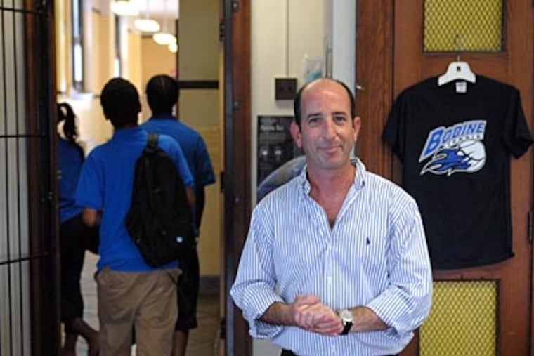 Aaron Greberman teaches his business technology class at Bodine High School for International Affairs. He says that “the best skill that I have as a teacher is the fact that I care.” (TOM GRALISH / Staff Photographer)