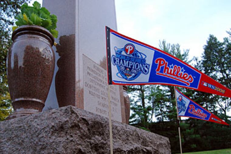 Phillies World Series championship pennants decorate a gravesite in West Laurel Hill Cemetery, Bala Cynwyd, Pa. (Donald D. Groff / For the Daily News)