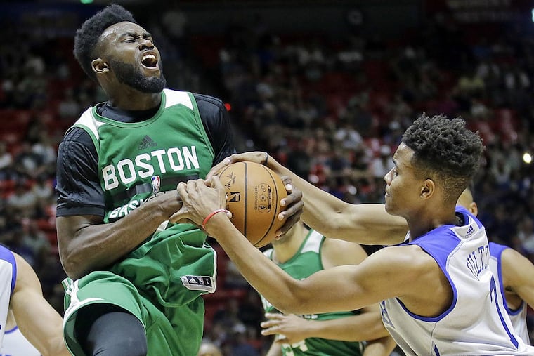 Philadelphia 76ers guard Markelle Fultz (7) defends against Boston Celtics forward Jaylen Brown, left, during the second half of an NBA summer league basketball game Monday, July 3, 2017, in Salt Lake City.