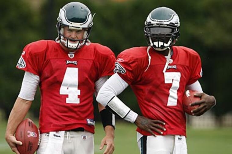 Once upon a time, Michael Vick (right) served as Kevin Kolb's (left) backup. (David Maialetti/Staff file photo)
