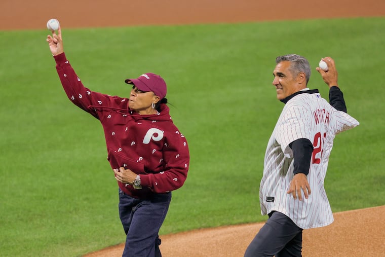 South Carolina coach Dawn Staley and former Villanova coach Jay Wright throw out the ceremonial first pitch before Game 1.