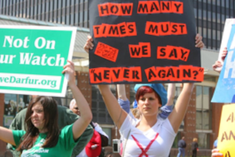 Laura Finkelstein (left), Sarah Harris participate in Darfur rally on lawn of Constitution Center.