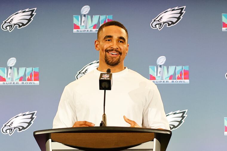 Eagles quarterback Jalen Hurts smiles answering questions during the team media availability for the Super Bowl.