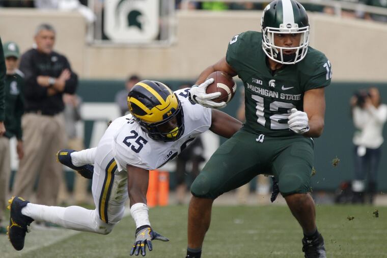 Michigan Wolverines cornerback Nate Johnson was taken to jail after being arrested outside a residence hall on campus and later released on a $5,000 personal recognizance bond.