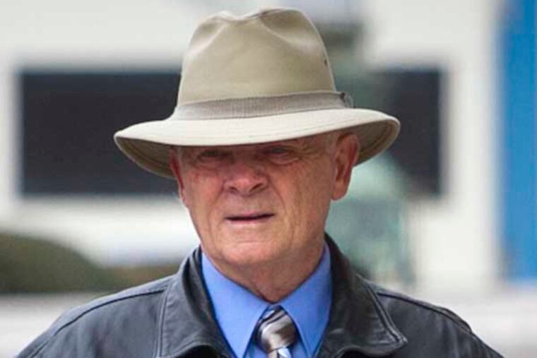 Walter Sasse, a retired Philadelphia police officer, enters Family Court at 18th and Vine St. on Tuesday, March 25, 2014. He is accused of alleged sexual assault of a minor.