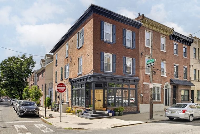 The exterior of the Queen Village home, which was formerly a gas station and before that, a tailor shop.