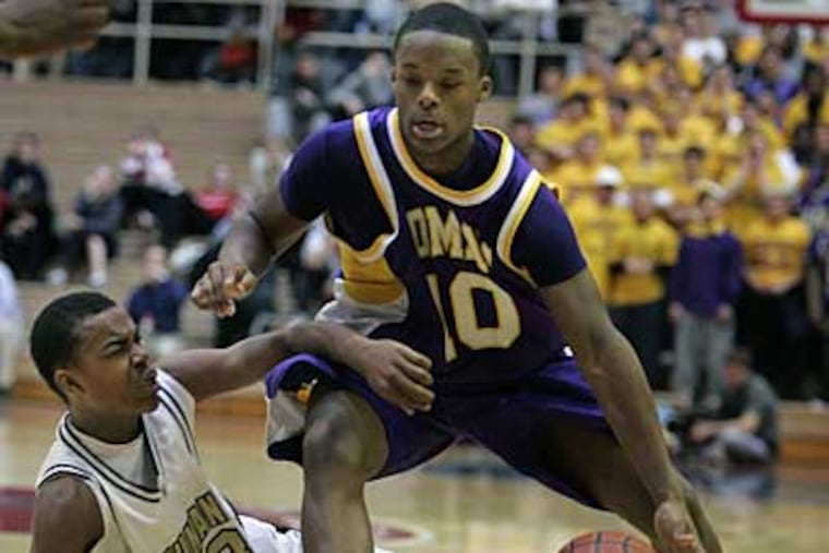 Roman Catholic's Maalik Wayns drives on Neumann-Goretti's Tony Chennault. (Ron Cortes / Staff Photographer)