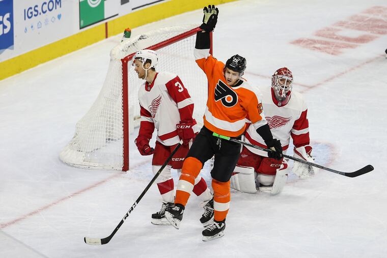 Flyers' James van Riemsdyk, celebrating a goal against Detroit on Dec. 18, faced his brother Trevor, a defenseman with Carolina, on Monday night.
