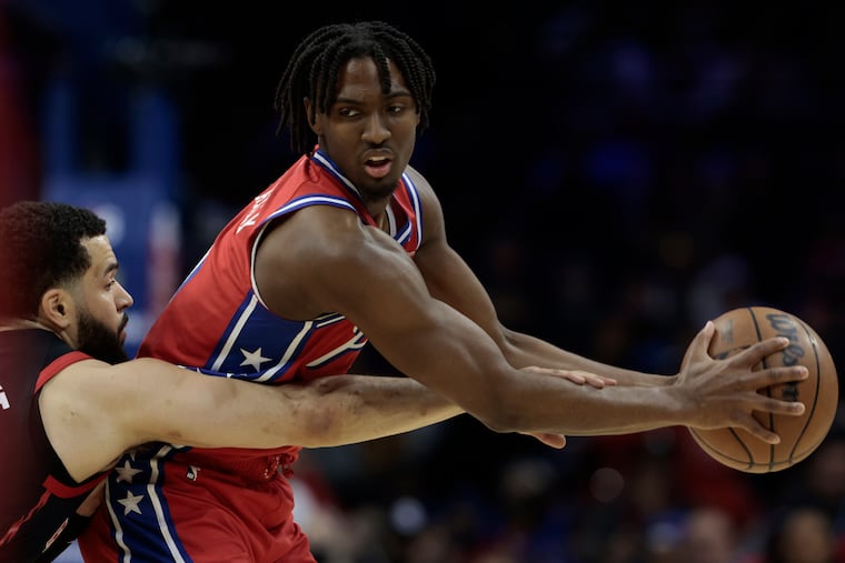 Tyrese Maxey (right) protects the ball from Fred VanVleet in the first quarter Friday.