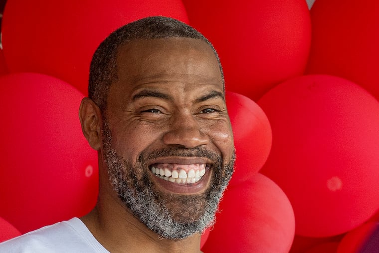 Former NBA player Rasheed Wallace smiles during a ceremony where the block of 18th and Hunting Park Ave was named Rasheed Wallace Road in 2022, once helped fund an AAU team for inner-city Philly girls' basketball players. The son of one of those players, Imhotep's Justin Edwards, is the first Public League player to be named a McDonald's All American since Wallace himself.