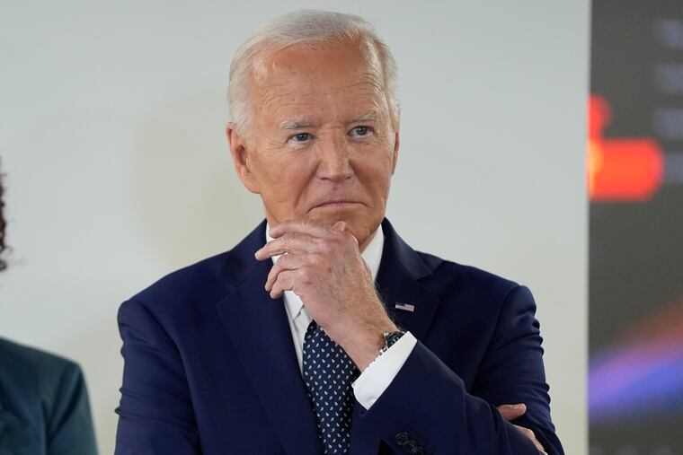 President Joe Biden listens during a visit to the D.C. Emergency Operations Center on Tuesday in Washington.