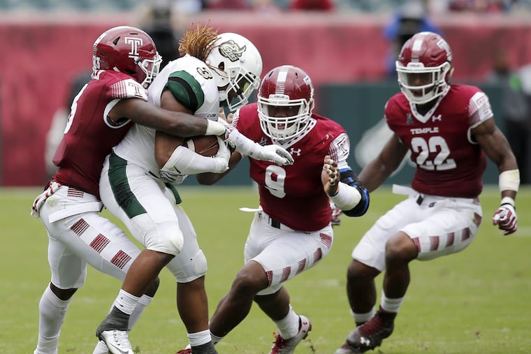 Temple's (l-r): Sean Chandler, Jacob Martin and Chapelle Russell go after Charlotte's Kalif Phillips on Saturday, September 24, 2016 in Philadelphia. YONG KIM / Staff Photographer