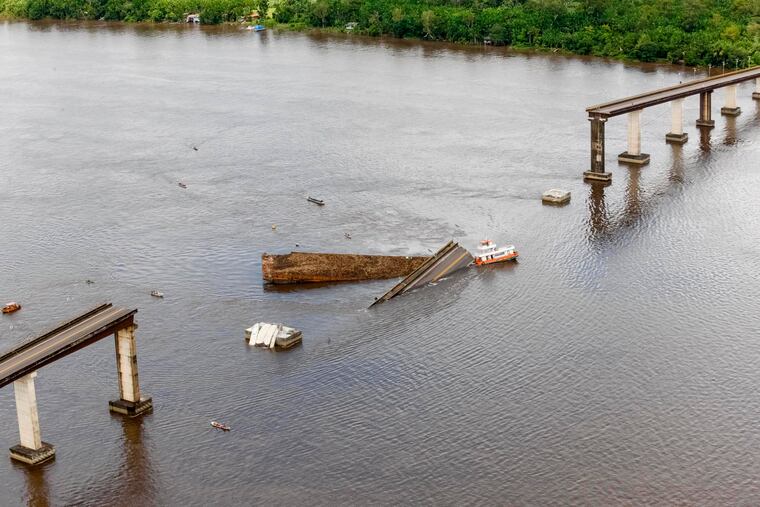 This Saturday, April 6, 2019 photo released by the Para Government shows a ferry boat which collided with a bridge pillar causing part of the bridge to collapse in the Moju river, in the Brazilian state of Para. Gov. Helder Barbalho said witnesses reported two small cars falling into the water during the accident, which occurred on a highway leading to the port city of Belem, the state capital.