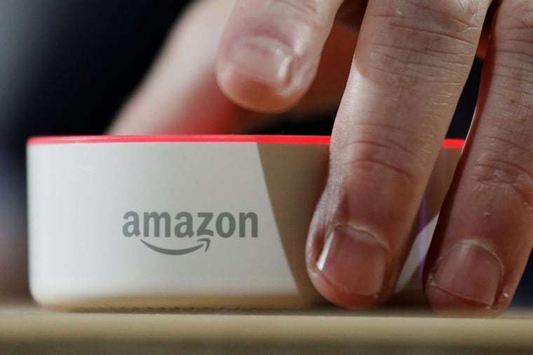 In this Wednesday, Sept. 27, 2017, file photo, an Amazon Echo Dot is displayed during a program announcing several new Amazon products by the company, in Seattle.