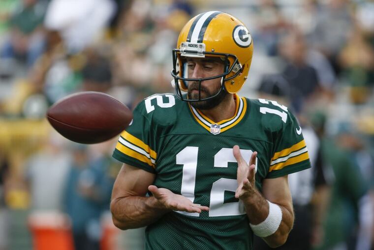 Wait a minute, Aaron. Aren’t you on the wrong end of this play? (AP Photo/Mike Roemer)