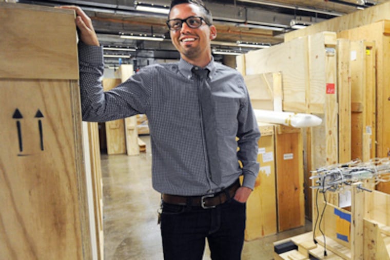 Derek Jones, son of Atelier's founder and now its executive director, stands in one of the firm's secret storage areas. (SHARON GEKOSKI-KIMMEL / Staff Photographer)