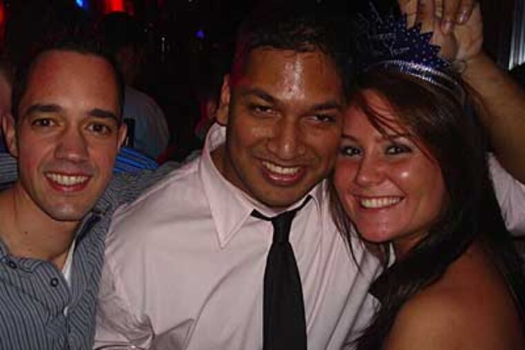 Snapshot of David Martinez celebrating with unidentified friends on New Year's Eve. He was found in a frozen pond outside a nightclub New Year's Day.