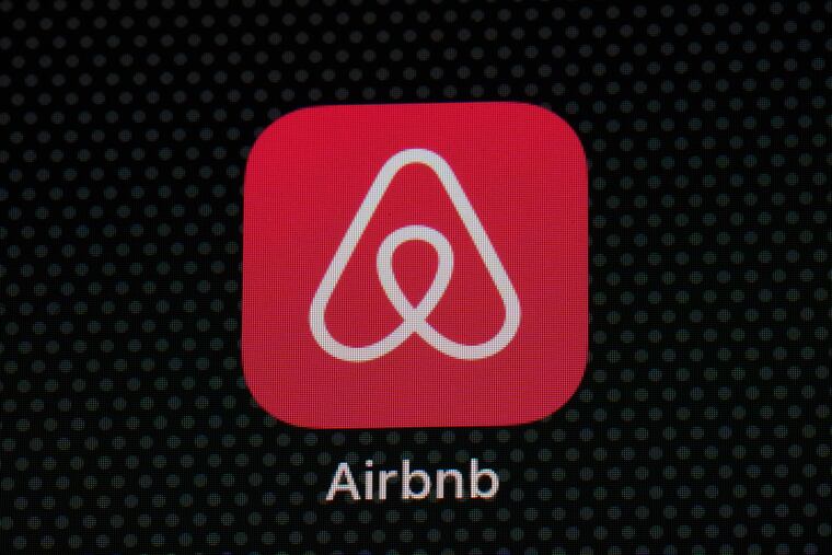 The Airbnb app icon on an iPad screen.