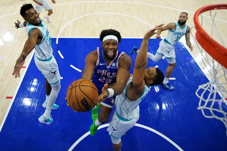 Guerschon Yabusele of the Sixers goes up for a shot against the Hornets' Grant Williams.