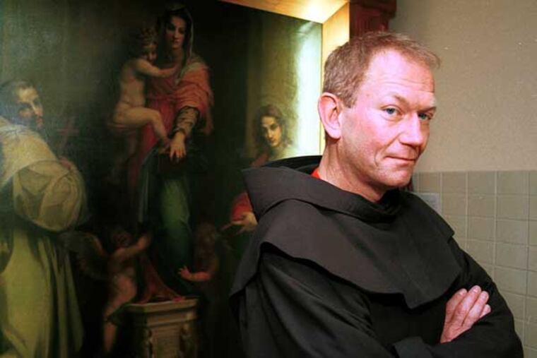 Michael Ledoux, shown in 2001, is now living at a Franciscan facility in New York and can have no direct contact with the public. File Photograph
Rev. Michael Dominic W. Ledoux (CQ), new director of the Neumann Institute for Franciscan Studies in Aston, Pa. IN THIS PHOTO: Rev. Michael W. Ledoux stands on the second floor of the main building at Neuman College in front of a painting created by Andrea Del Sarto (1467-1531) around 1517 which depicts the Assumption of Mary. Rev. Ledoux begins his new position in August. He is currently an assistant professor at the college. Photo 1 of 2