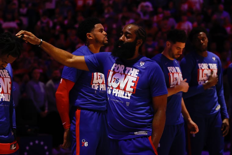 Sixers guard James Harden pats a teammate on the head during player introductions before Game 1 of the first round in the Eastern Conference playoffs on Saturday, April 15, 2023 in Philadelphia.
