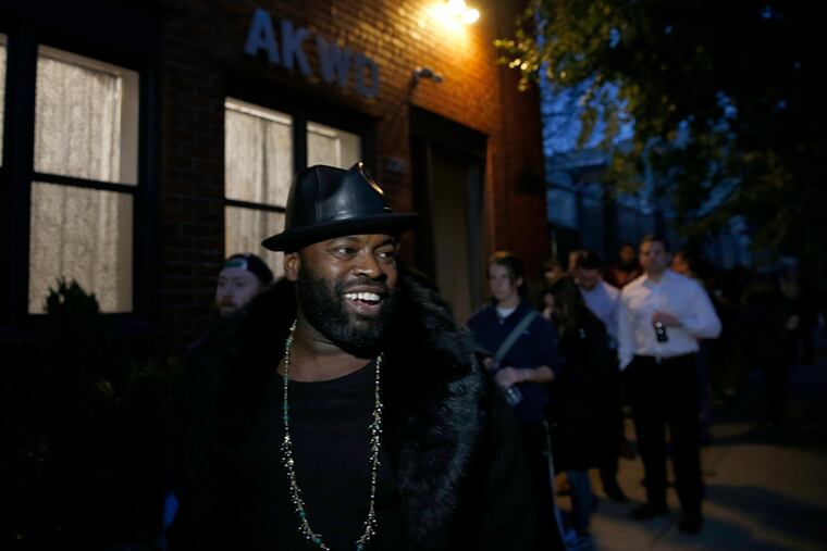Tariq "Black Thought" Trotter of The Roots smiles after passing out water bottles to people waiting to vote at the Northern Liberties Community Center on Election Day in Philadelphia, PA on November 8, 2016. DAVID MAIALETTI / Staff Photographer