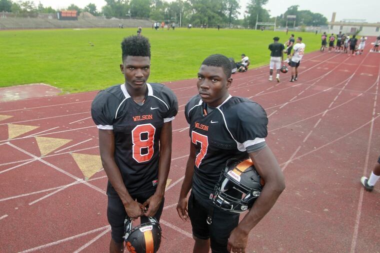 Brothers Stanley (left) and Travon King lead the Woodrow Wilson football team.