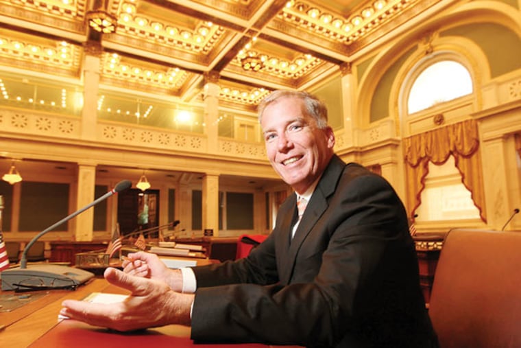 New Philadelphia City Councilman Ed Neilson sits at his desk in Council chambers. (Michael Bryant / Staff Photographer)