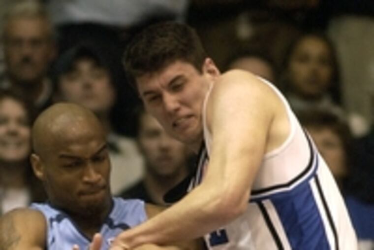 Duke's Brian Zoubek (right) battles UNC'S Reyshawn Terry. The Haddonfield graduate should have a chance at a starting position.