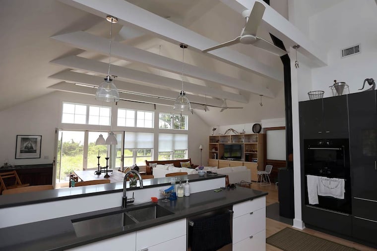 The kitchen and living room that the Guys furnished in part from antiques stores and thrift shops.