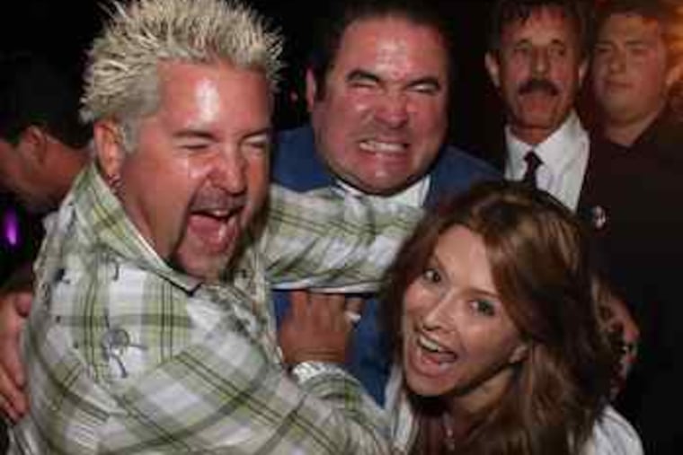 Cooking up some mischief, celebrity chefs (from left) Guy Fieri, Emeril Lagasse, and Ingrid Hoffman got a little crazy Sunday at the Atlantic City Food and Wine Festival at Bally's Atlantic City.