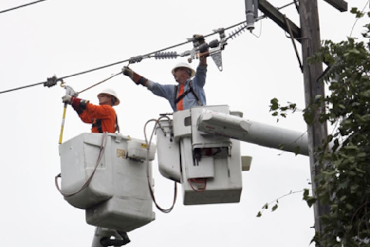 Peco's price for residential electric power has gone up 12 percent this year. Above, a repair crew in Chester County after Hurricane Irene downed lines. (Laurence Kesterson / Staff Photographer)