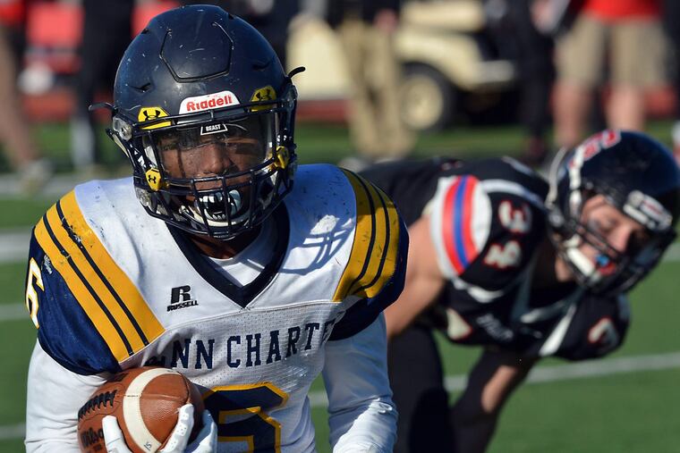 Penn Charter running back Edward Saydee (6) , races past Germantown Academy defenders during Inter-Ac action last November.