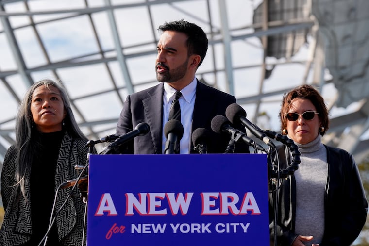 Zohran Mamdani, mayor-elect of New York, center, joined by members of his transition team, speaks to members of the media at Flushing Meadows Corona Park in the Queens borough of New York on Wednesday, Nov. 5, 2025.