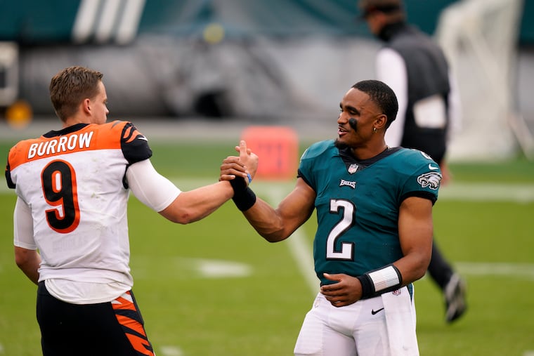 Joe Burrow greets Jalen Hurts after the Bengals and Eagles played in their rookie season. The pair finished 1-2 in Heisman voting and made the College Football Playoff the season before.