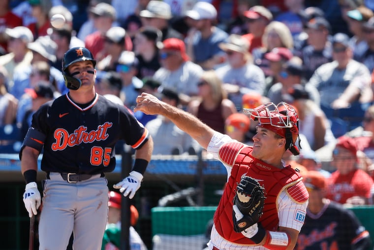 Catcher J.T. Realmuto throws the ball back to pitcher Cristopher Sánchez after the Phillies challenged the third strike on Detroit's Kevin McGonigle during a spring training game. McGonigle, a Delco native, was called out looking after the review.
