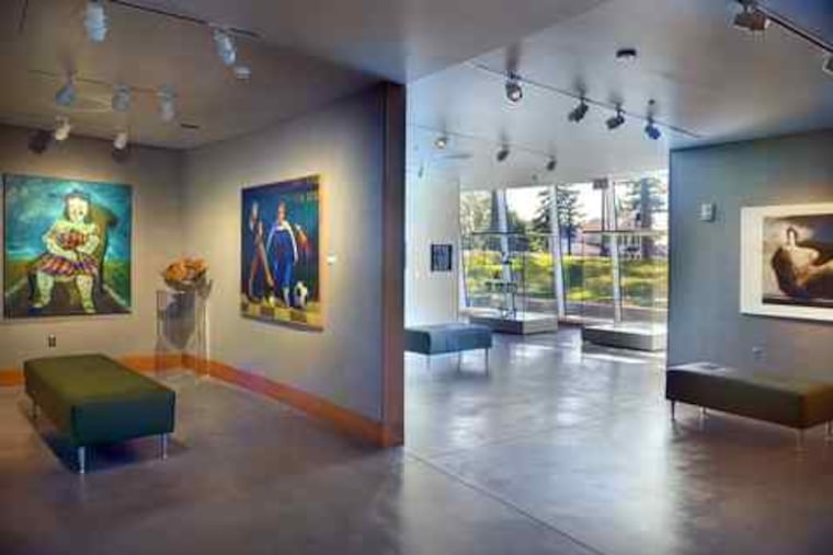 The new Pfeiffer wing of the Berman Museum at Ursinus College is partly below grade, with a curved window wall allowing displays to be seen from outdoors.