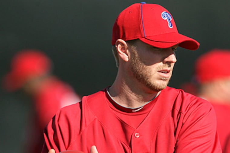 Phillies' pitchers Roy Halladay warms-up during spring training workouts at Bright House Field in Clearwater. (Yong Kim / Staff Photographer)