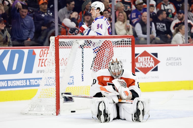 Flyers goaltender Dan Vladar sits on the ice after New York Rangers center Mika Zibanejad’s second period power play goal on Monday.
