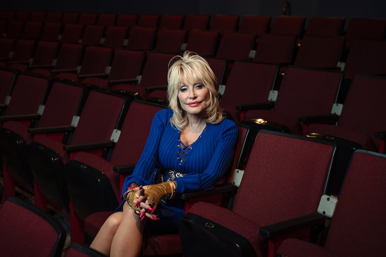 FILE -- Dolly Parton in a theater at Dollywood, her theme park in Pigeon Forge, Tenn., May 10, 2019. Parton, the country singer, songwriter, entertainer and entrepreneur whose rags-to-riches story, outsize persona and prodigious vision and talent placed her in a class by herself, died in Nashville on Tuesday, Aug. 25, 2026. She was 80.