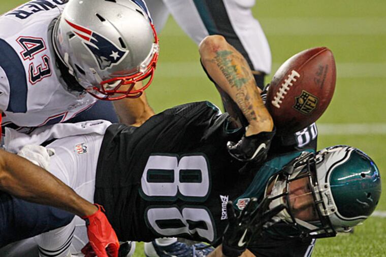 Jeff Maehl fumbles after a reception. (Ron Cortes/Staff Photographer)
