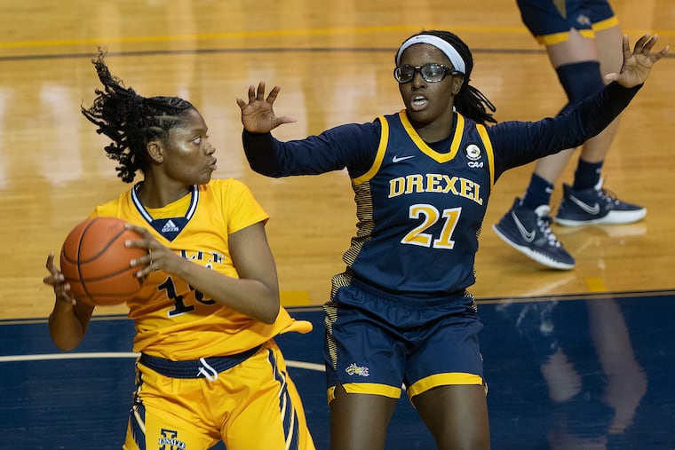 La Salle's Kayla Spruill (left), seen here in action against Drexel, led the Explorers in a 74-65 win over George Washington on Saturday at Tom Gola Arena.