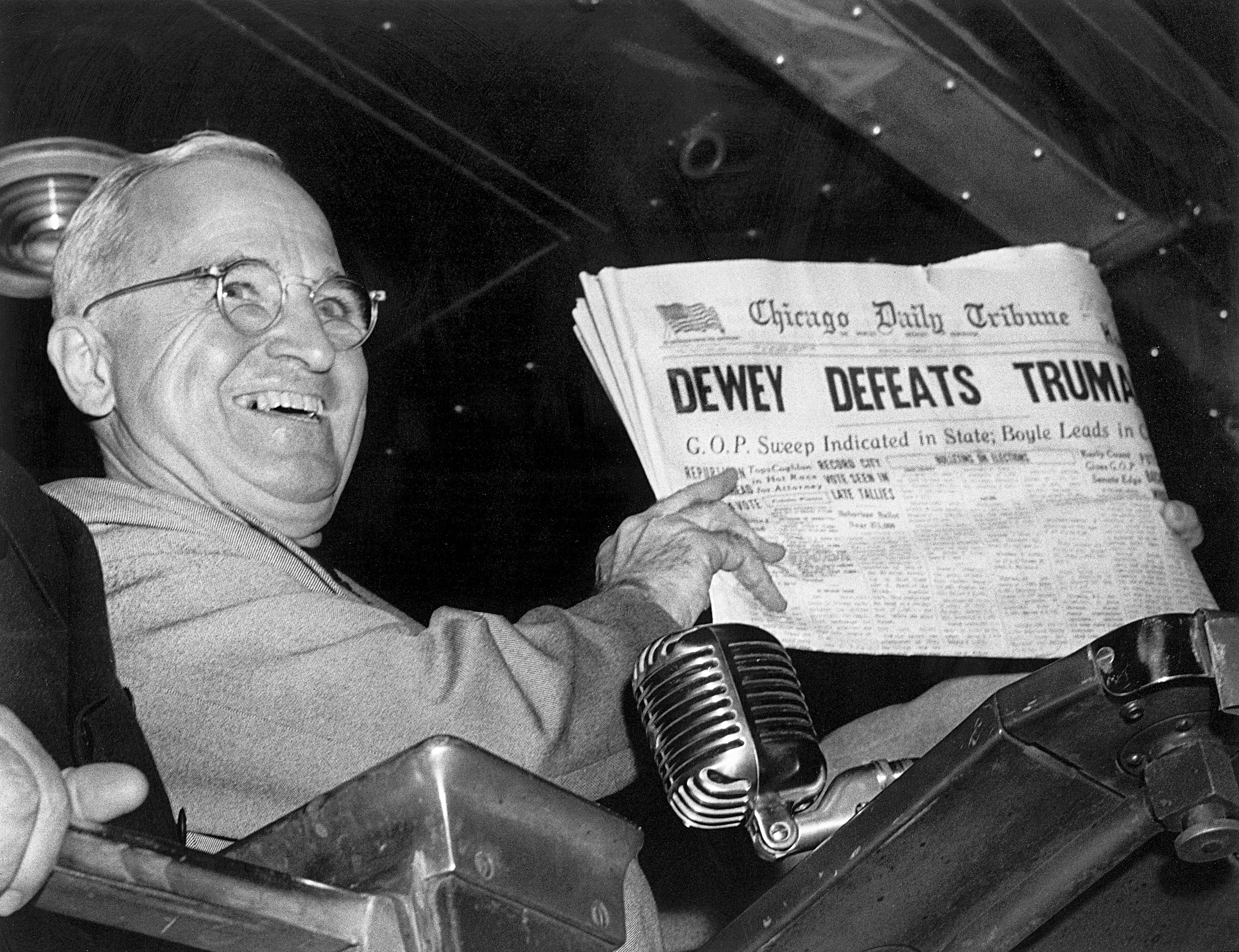 In this Nov. 4, 1948, file photo, President Harry S. Truman at St. Louis' Union Station holds up an Election Day edition of the Chicago Daily Tribune, which — based on early results — mistakenly announced "Dewey Defeats Truman."