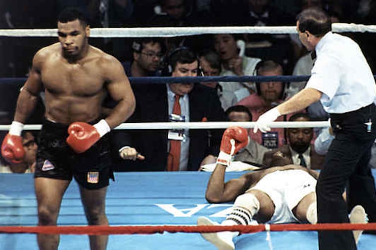 Mike Tyson had a career record of 50-6 with 44 knockouts. Here he walks to a neutral corner after knocking down Michael Spinks in Atlantic City.