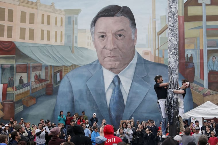 The mural of former Mayor Frank Rizzo looms over festivities at the Ninth Street Italian Market.