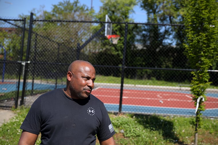 West Philadelphia High School basketball coach Adrian Burke talks about a double shooting at Deritis Playground in Southwest Philadelphia. Philadelphia police said Quamir Mitchell, 16, was shot and killed at the playground Thursday night, and a 13-year-old was shot and injured. Mitchell played on the West Philadelphia High basketball team.