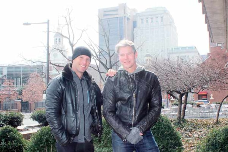 With Independence Hall in the background, restaurateur Michael Schulson (left) and designer David Fierabend of Groundswell Design Group on the future site of Independence Beer Garden. ( MICHAEL KLEIN / Philly.com )