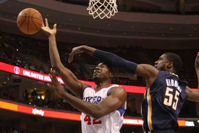 Roy Hibbert (right) fouls Elton Brand.