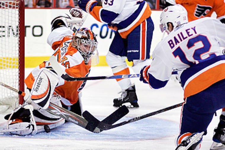 Flyers goalie Sergei Bobrovsky makes a pad save during the first period against the Islanders. (AP Photo/Tom Mihalek)