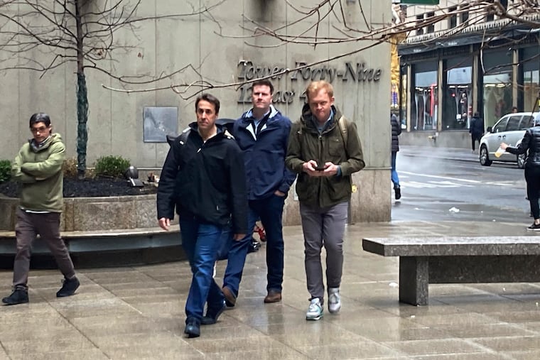 MLB negotiators -- led by deputy commissioner Dan Halem, front -- arrive Sunday at the New York office of the Players Association for collective bargaining talks.